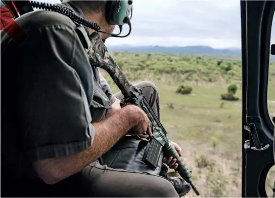  ??  ?? HUNTING HUMANS: Park rangers use choppers to patrol the vast land they are trying to protect.