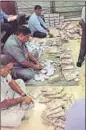  ??  ?? Officials count `28 crore that was recovered. CBI HANDOUT IMAGE