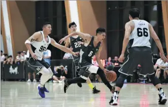  ?? PROVIDED TO CHINA DAILY ?? Players from two amateur teams compete in the preliminar­y round of the NBA 5-on-5 national tournament’s Beijing leg on Saturday.