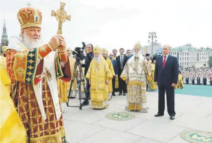  ?? Mikhail Klimentyev, Sputnik Kremlin ?? Russian Orthodox Church Patriarch Kirill, left, leads a religious service July 28 as Russian President Vladimir Putin, right, and Eastern Orthodox Patriarch of Alexandria and all Africa Theodoros II, second right, attend.