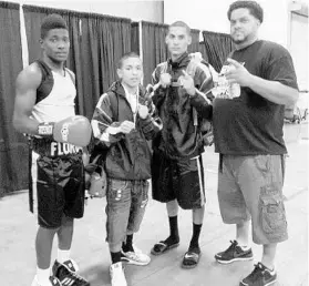  ?? COURTESY OF JASON GALARZA ?? From left, Erickson Lubin, Norberto Torres and Dennis Galarza with trainer Jason Galarza in 2013. A promising fighter, Torres, who needs a kidney transplant, last fought in 2014.