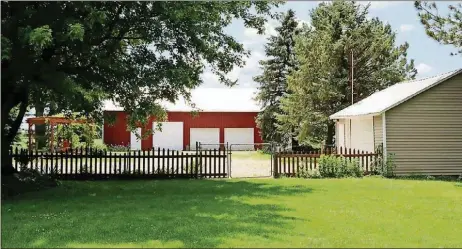  ??  ?? The 15.36-acre property includes a barn, 2-car garage, 1-car detached garage, fenced yard, rear decks, gazebo, 11 acres of tillable land and an acre of woods.