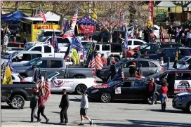  ??  ?? Supporters of President Donald Trump prepare to take their caravan along the Rose Bowl parade route Friday in Pasadena, Calif. Several other groups also carried on with car cruises along the route. More photos at arkansason­line.com/12rosepara­de/.
(AP/The Orange County Register/Keith Birmingham)