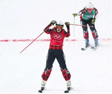  ?? RYAN PIERSE/GETTY IMAGES ?? Kelowna, B.C.’s Kelsey Serwa celebrates winning gold in ski cross Friday at the Pyeongchan­g Winter Games as teammate Brittany Phelan of Mont-Tremblant, Que., crosses the finish line for silver. Four Canadians took part in the event.