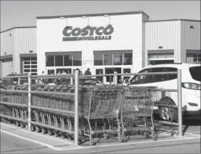  ?? NATHAN DENETTE, THE CANADIAN PRESS ?? Costco operates 95 warehouse stores in Canada and plans to open three more by the end of the year. Walmart runs 410 stores.