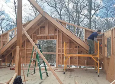  ?? JENNIFER BUCK ?? Jennifer Buck is building a two-story, 2,000-square-foot home on 3 acres in Sharon, Conn., from a kit sold by Shelter-Kit.
