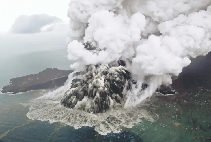  ??  ?? This aerial picture shows the Anak Krakatoa volcano erupting in the Sunda Straits off the coast of southern Sumatra and the western tip of Java. — AFP photo