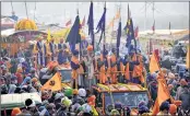  ??  ?? Nihang Sikhs, devotees and farmers take part in ‘nagar kirtan’ during the protest at Singhu border in Delhi on Wednesday.