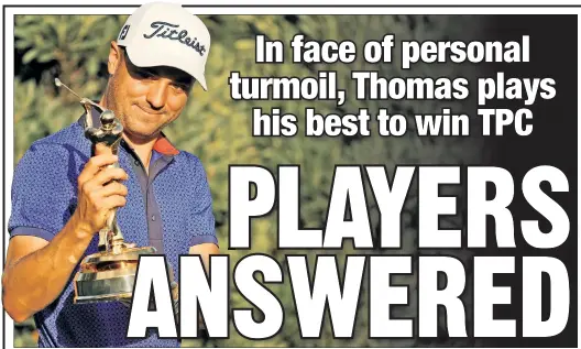  ?? Getty Images ?? CAN’T TAKE MY EYES OFF OF YOU: Justin Thomas holds up the Players Championsh­ip trophy at TPC Sawgrass on Sunday after winning the tournament while shooting a record-tying 12-under on the final 36 holes.