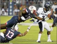  ?? ASSOCIATED PRESS FILE PHOTO ?? UConn’s Vontae Diggs (13), bottom left, will be returning from a preseason knee injury against Virginia on Saturday.