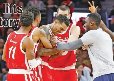  ??  ?? Matt Barnes of the Memphis Grizzlies celebrates with his teammates after hitting a half court shot that gave his team a thrilling 93-92 victory over the Detroit Pistons. (AP)