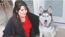  ?? Tribune News Service ?? Democratic Rhode Island state Rep. Charlene Lima and her husky, Keiko. Lima has introduced a bill in the state legislatur­e dealing with pet custody, a growing issue in divorce cases.