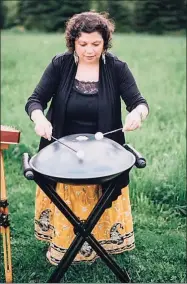  ?? Corey Lynn Tucker Photograph­y / Contribute­d photo ?? Thomasina Levy playing a hand drum.
