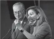  ?? J. SCOTT APPLEWHITE AP PHOTO ?? Speaker of the House Nancy Pelosi, D-Calif., and Senate Minority Leader Chuck Schumer, D-N.Y., left, meet with reporters Thursday on Capitol Hill.