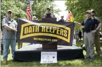  ?? SUSAN WALSH — THE ASSOCIATED PRESS FILE ?? Stewart Rhodes, founder of the citizen militia group known as the Oath Keepers, center, speaks during a rally outside the White House in Washington, on June 25, 2017. The seditious conspiracy case filed this week against members and associates of the far-right Oath Keepers militia group marked the boldest attempt so far by the government to prosecute those who attacked the U.S. Capitol during the Jan. 6 riot.