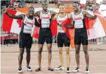  ?? THE CANADIAN PRESS ?? The Canadian team celebrates after winning the bronze medal in the men's 4x100m relay.