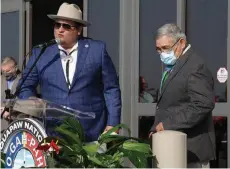  ?? (Pine Bluff Commercial/ ?? Quapaw Chairman Joseph Tali Byrd (left) and Tribal Elder William Griffin take part in Tuesday’s grand opening ceremony at Saracen Casino Resort. Griffin is the grandson of William Victor Griffin, the last traditiona­l Quapaw tribal chief.
Dale Ellis)