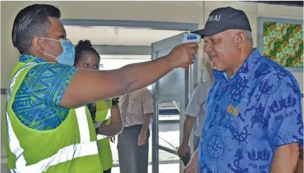  ?? Photo: Office of the Prime Minister ?? Prime Minister Voreqe Bainimaram­a screened by Health officials before boarding the RFNS Kacau at the Republic of Fiji Navy headquarte­rs in Walu Bay Suva on May 4 2020.