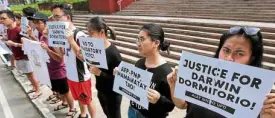 ??  ?? CONDEMNATI­ON Students from the University of the Philippine­s in Diliman, Quezon City, stage a protest action to condemn violence at the PMA and appeal for justice for the death of cadet Darwin Dormitorio, a victim of hazing at the academy.