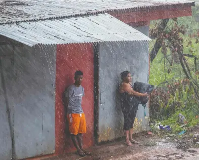 ?? STR / AFP VIA GETTY IMAGES ?? Heavy rains drench Puerto Cabezas, Nicaragua, Monday as Hurricane Iota moves over the Caribbean toward the Nicaragua-Honduras border. The Category 5 hurricane was set to slam into Central America late Monday.