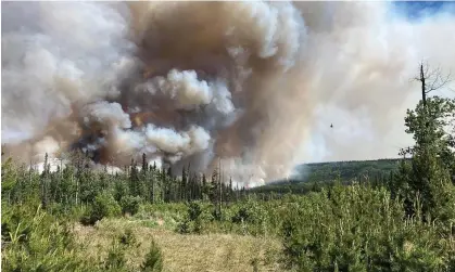  ?? Canada. Photograph: BC Wildfire Service/AFP/Getty Images ?? A handout image provided by the BC wildfire service on 7 June shows smoke from the West Kiskatinaw River and Peavine Creek wildfires in the Dawson Creek Zone, British Colombia,