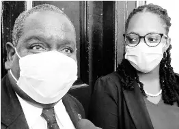  ?? PHOTO BY CARL GILCHRIST ?? Losing JLP candidate Delroy Granston speaking to the media while his attorney, Dania Allen, looks on at the St Ann’s Bay courthouse on Wednesday.