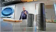  ?? [AP FILE PHOTO] ?? David Limp, senior vice president of devices and services at Amazon, displays a new Echo, left, and an Echo Plus during an event announcing several new Amazon products by the company, in Seattle. Internet-connected lights, locks and laundry machines...