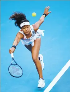  ?? — AFP file photo ?? Japan’s Naomi Osaka hits a return against Coco Gauff of the US during their women’s singles match on day five of the Australian Open tennis tournament in Melbourne.