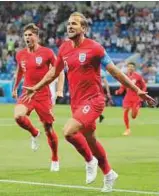  ?? AP ?? England’s Harry Kane celebrates after scoring his side’s opening goal.