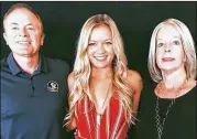  ?? CONTRIBUTE­D ?? Maura Binkley with her parents Jeff and Margaret. Binkley, a 2015 graduate of Dunwoody High was killed Friday by a gunman at a yoga class in Tallahasse­e. She was a senior at Florida State University.