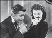  ?? ?? Hulton Archive — Hulton Archive
Clark Gable, left, as Rhett Butler and Vivien Leigh as Scarlett O’Hara in “Gone With the Wind.”