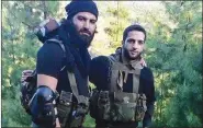  ??  ?? HuM commander Sabzar Bhat (left) with Burhan Wani.