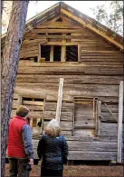  ??  ?? Built by John Henderson Tate in 1829, this two-story log cabin is the oldest house still standing in Ouachita County.