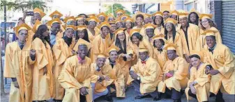  ?? DEMOCRACY PREP PUBLIC SCHOOLS ?? Students from Democracy Prep Public Schools celebrate graduation day at New York’s Apollo Theater. The network says nearly nine in 10 alumni are on track to earn a four- year degree.