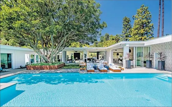  ?? Photograph­s by Everett Fenton Gidley ?? A RESTORED AND expanded Beverly Hills home now belongs to Cindy Crawford and Rande Gerber, who paid $11.625 million for it.