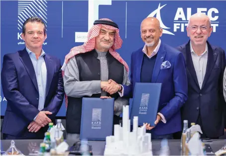  ?? ?? Saudico CEO Bashir Al-Azem and KAFD DMC CEO Gautam Sashittal sign the agreement, in the presence of Laurent Farge and Kadir Karademir.