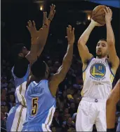  ?? BEN MARGOT — THE ASSOCIATED PRESS, FILE ?? The Warriors’ Klay Thompson, right, shoots over the Nuggets’ Will Barton (5) during the second half of their 2017 game in Oakland.