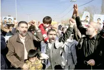  ??  ?? Iranians chant slogans during a rally against anti-regime protestors in Tehran on Friday. (AP)