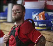  ?? ROSS D. FRANKLIN - THE ASSOCIATED PRESS ?? In this Feb. 28, 2020, file photo, Cincinnati Reds catcher Tucker Barnhart pauses in the dugout during the third inning of a spring training game against the Oakland Athletics in Goodyear, Ariz.