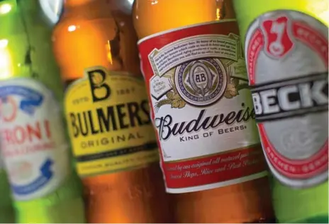  ?? JUSTIN TALLIS/AFP/GETTY IMAGES ?? Anheuser-Busch InBev said Tuesday that it would now pay £45 ($78 Canadian) a share in cash for SABMiller, an increase of $1.73 from its prior offer.