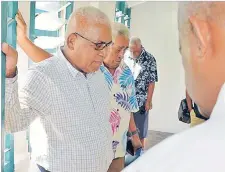  ?? Picture: ELIKI NUKUTABU ?? Interim school chairman Fotu Yavala (left), Jimi Savu and Asaeli Naisoro at a prayer session inside the new teachers quarters.