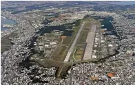  ?? Kyodo News via AP, File ?? ■ This Jan. 27, 2018, aerial file photo shows U.S. Marine Air Station Futenma in Ginowan, Okinawa, southern Japan. Okinawan officials said Saturday that dozens of U.S. Marines have been confirmed to have been infected with the coronaviru­s at two bases, Futenma and Camp Hansen, on the southern Japanese island in what is feared to be a massive outbreak, and demanded adequate explanatio­n from the U.S. military officials.