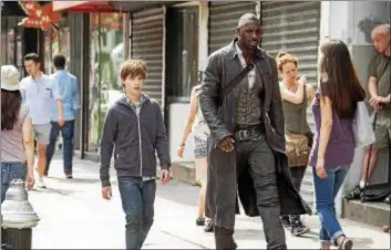  ?? COLUMBIA PICTURES PHOTOS ?? Tom Taylor, as Jake, and Idris Elba, as Roland, share a scene in “The Dark Tower.”