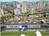  ?? MATIAS DELACROIX/AP ?? Banners with “Long live King Pele, 82 years” in Portuguese are displayed in the stands of the Vila Belmiro stadium, home of the Santos soccer club, where Pele’s funeral will take place, in Santos, Brazil.