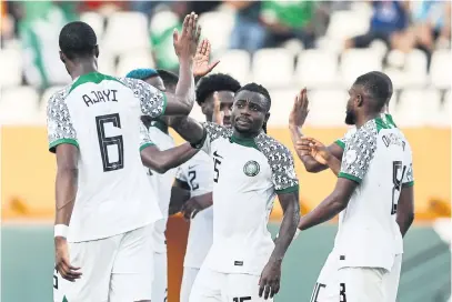  ?? Picture: AFP ?? LUCKY. Nigeria’s Moses Simon (centre) celebrates with team-mates after Guinea-Bissau scored an own goal during their Africa Cup of Nations Group A match in Abidjan on Monday night.