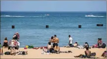  ?? BRIAN CASSELLA / CHICAGO TRIBUNE FILE ?? People enjoy the hot weather at North Avenue Beach in Chicago. The Centers for Disease Control and Prevention says “dry drowning” is not a medically accepted term.