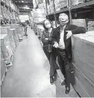  ?? Jenny Sparks, Reporter- Herald ?? Will Taylor, shown with Debbie Taylor, prepares for the delivery of a large donation of food from the Church of Jesus Christ of Latter- day Saints to the Food Bank of Larimer County in Loveland.