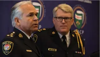  ?? VANESSA TIGNANELLI, THE RECORD ?? Ottawa Police Chief Charles Bordeleau, left, and Waterloo Regional Police Chief Bryan Larkin answer questions Monday at the annual meeting of the Ontario Associatio­n of Police Chiefs.
