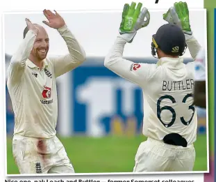  ?? SRI LANKA CRICKET ?? Nice one, pal: Leach and Buttler — former Somerset colleagues — celebrate after the spinner snares Mathews