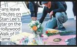  ??  ?? Fans leave tributes on Stan Lee’s star on the Hollywood Walk of Fame.